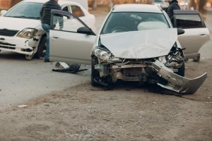 Learn About Using An MIB Compensation Calculator Accident scene of two badly damaged cars.